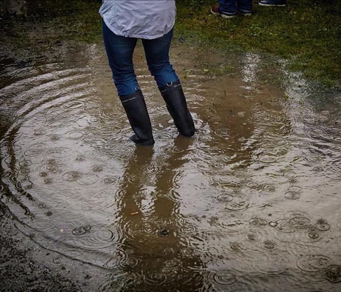 Person standing in flood waters